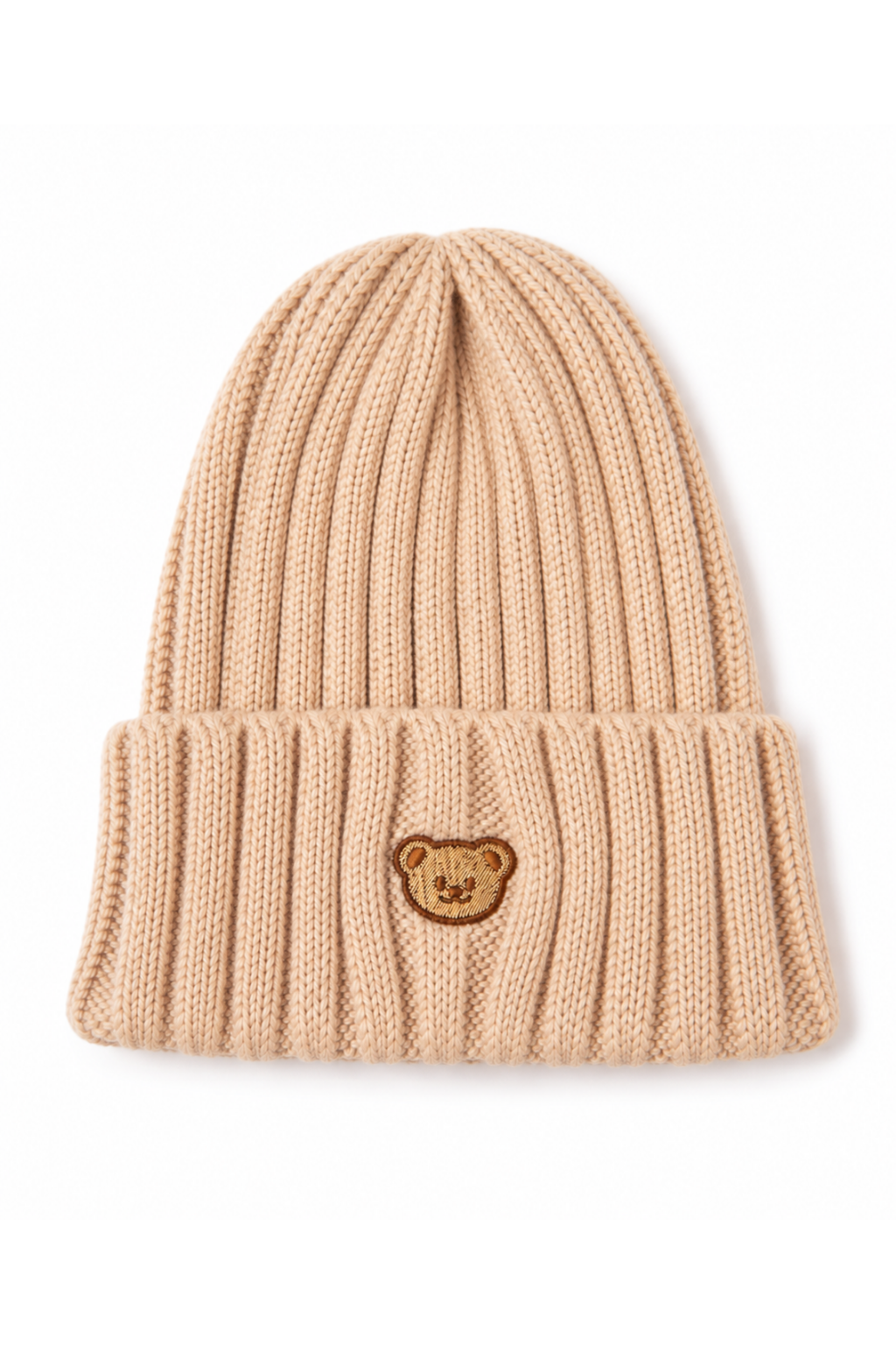 A beige ribbed knit beanie hat featuring a small embroidered brown teddy bear face patch on the front cuff, set against a plain white background.