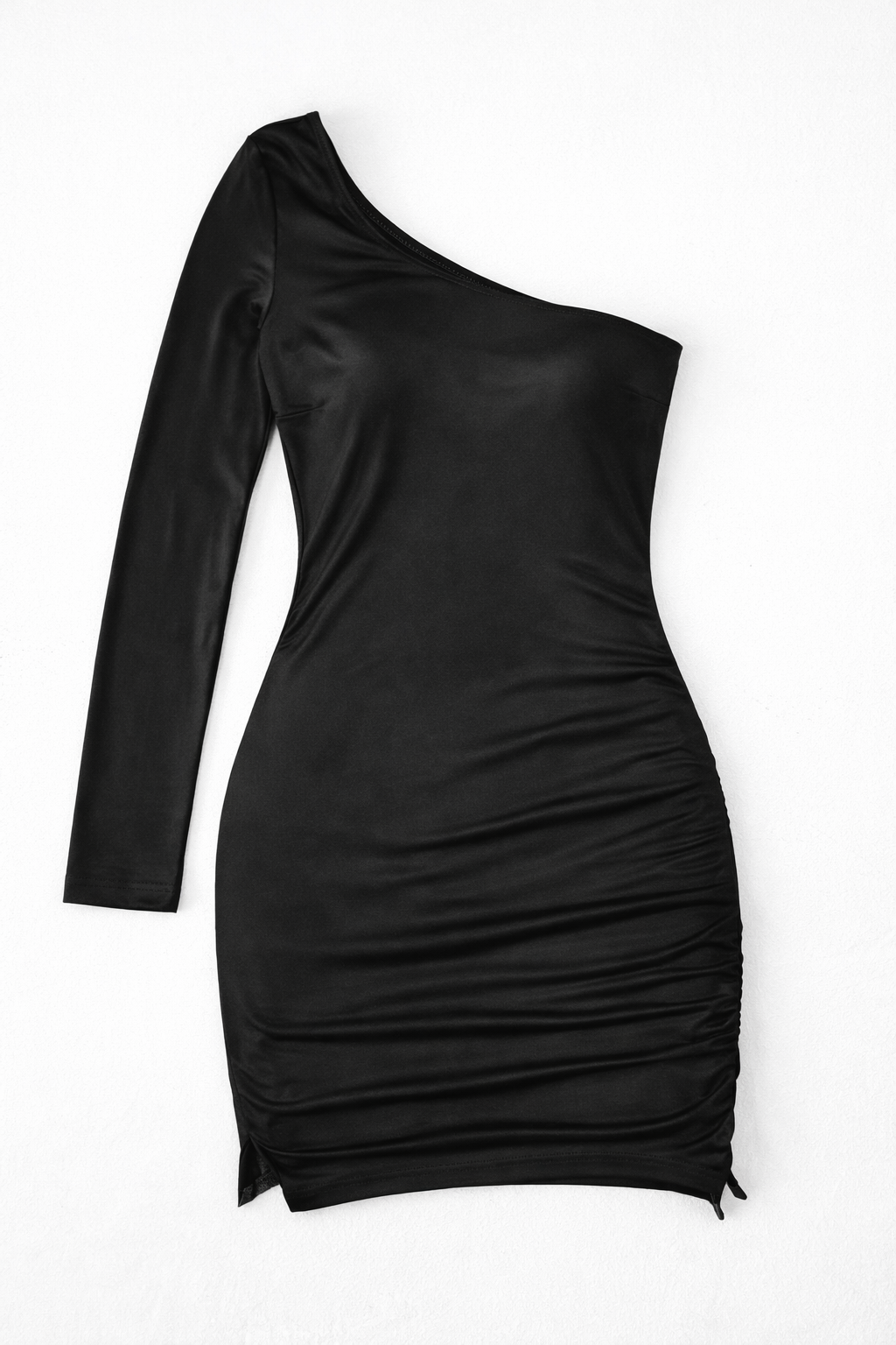 A black one-shoulder long-sleeve bodycon mini dress with ruching, shown flat against a plain white background.